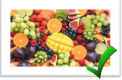 Frisk frugt med et grønt hak som markerer at det er sundt at spise